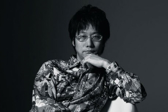 A black and white picture of Hideo Kojima