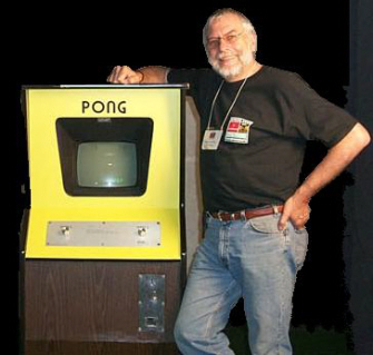 Nolan Bushnell next to Pong arcade machine
