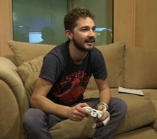 Shia LaBeouf playing Transformers 2: Revenge of the Fallen the videogame on Xbox 360
